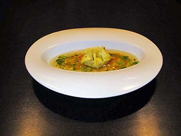 Bouillon van wilde eend met tortellini van eekhoorntjesbrood 